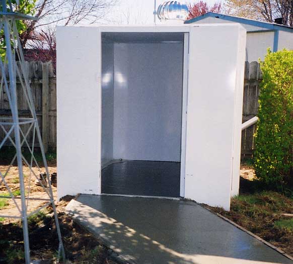 6 x 8 steel, handicap accessible storm shelter with a poured concrete floor.